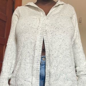 white cardigan with black design spots